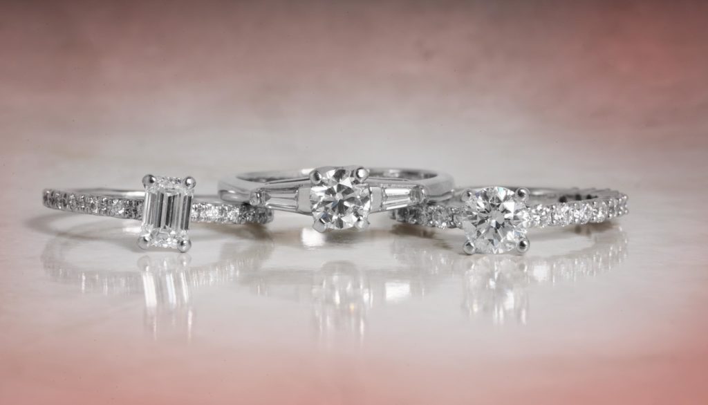 image of 3 engagement rings with side stones