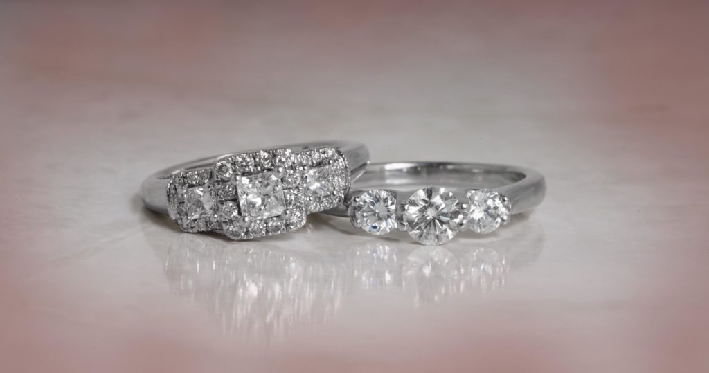 image of 2 three-stone diamond rings