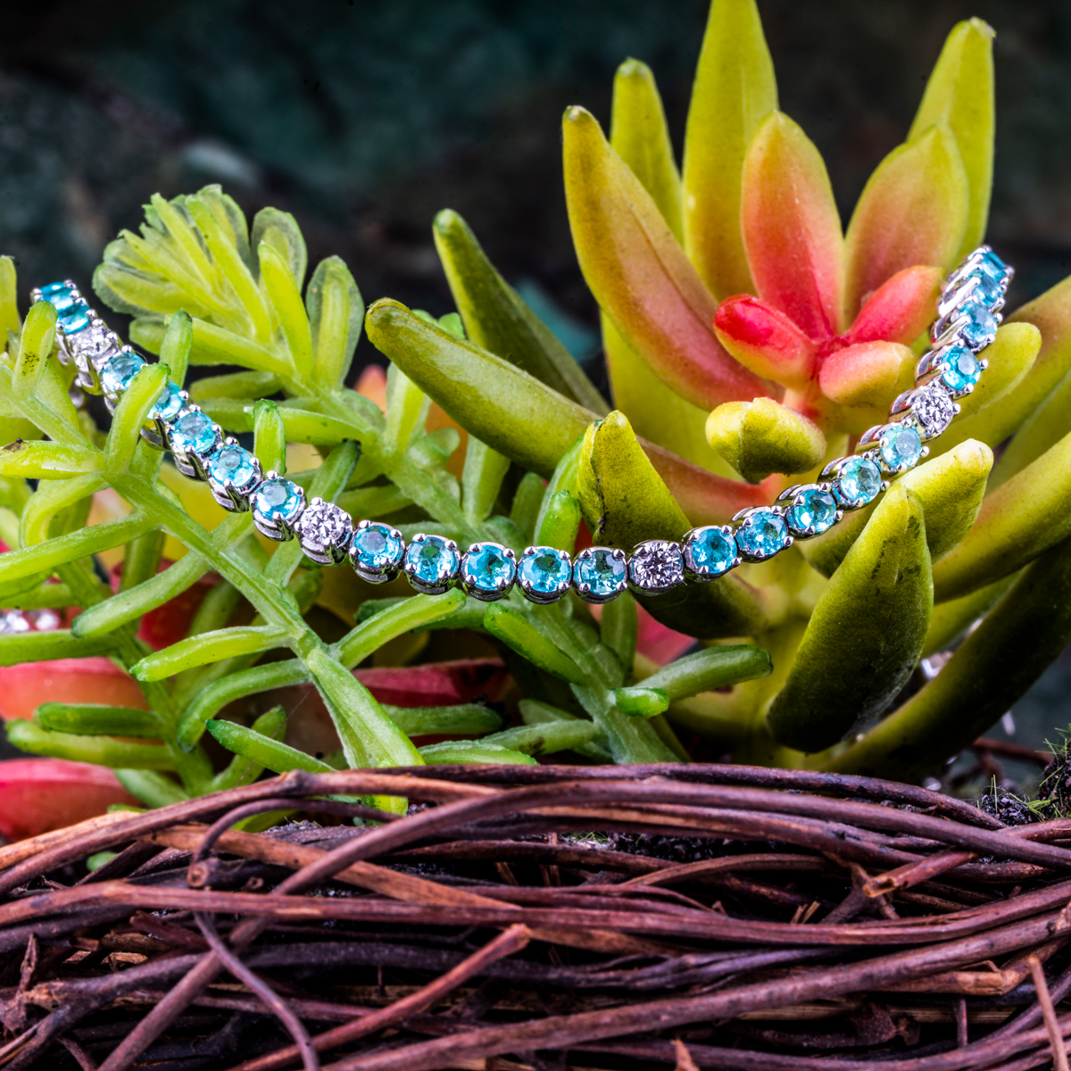 White gold Paraiba tourmaline and diamond tennis bracelet.