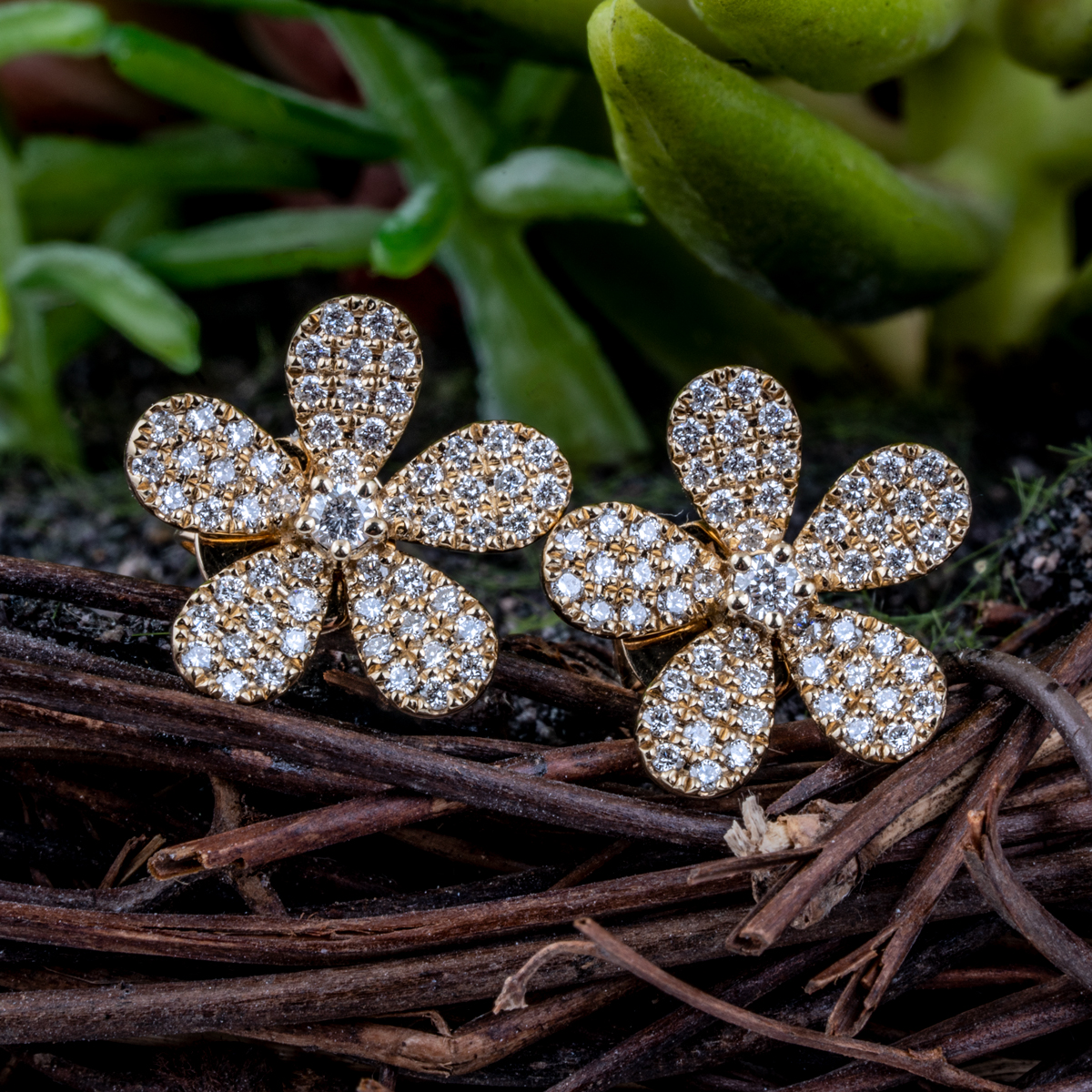 Yellow gold diamond flower stud earrings.