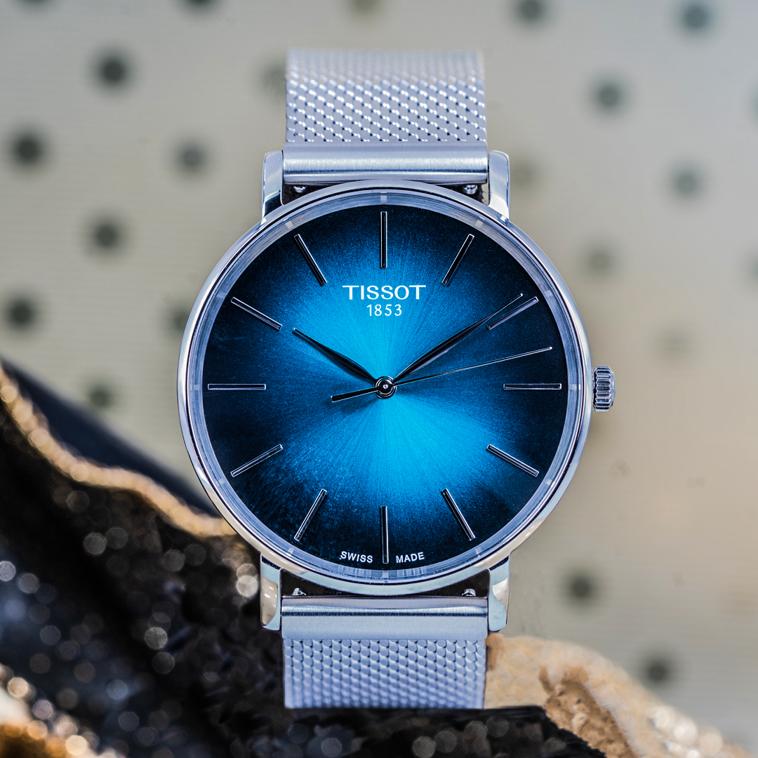 Pre-owned men's Tissot Everytime in stianless steel with a blue ombre dial.