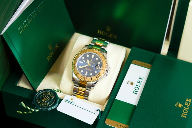 Rolex displayed in Rolex box with card.