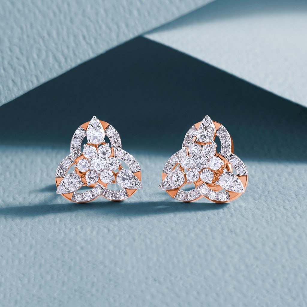 Rose gold three-leaf clover twist stud earrings set with lab-grown diamonds.