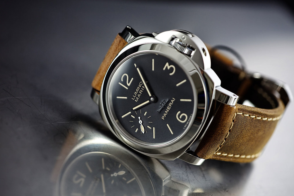 Men's Panerai Luminor in stainless steel with a black dial and brown leather strap.