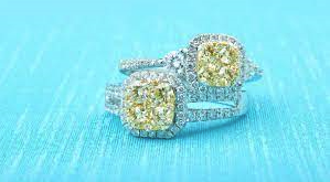 Madison L engagement rings set with yellow diamonds.