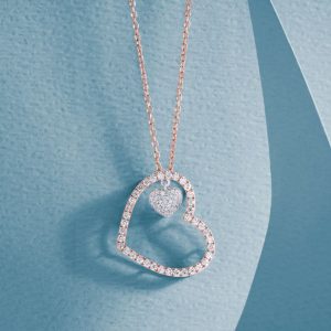 Yellow gold open heart necklace set with diamonds.