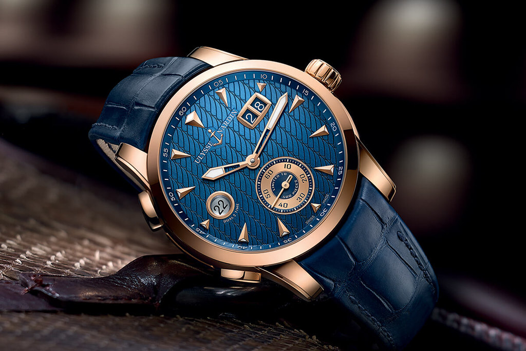 Men's Ulysse Nardin in yellow gold with a blue dial and leather strap.