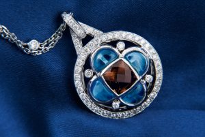 Smokey and blue topaz pendant with a diamond bail.