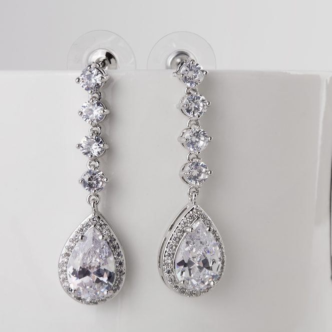 White gold drop earrings set with pear cut diamonsd.