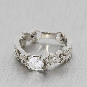 Vintage art deco engagement ring centered with a diamond.