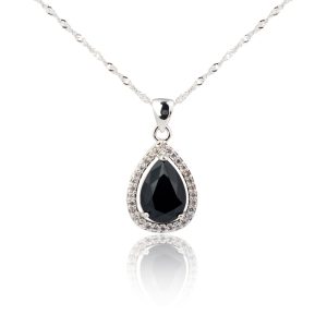 White gold pendant centered with a pear cut black diamond surrounded by a white diamond halo.