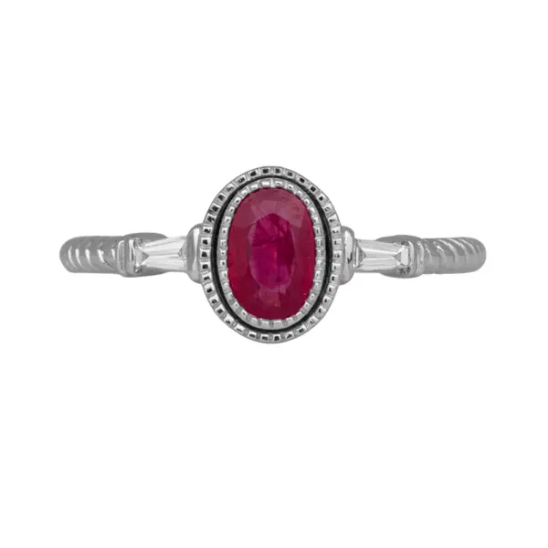 A close up of a New 14k white gold Venetti 3-stone ring centered with a 0.66 carat oval ruby flanked by 0.07 carats of baguette diamonds.