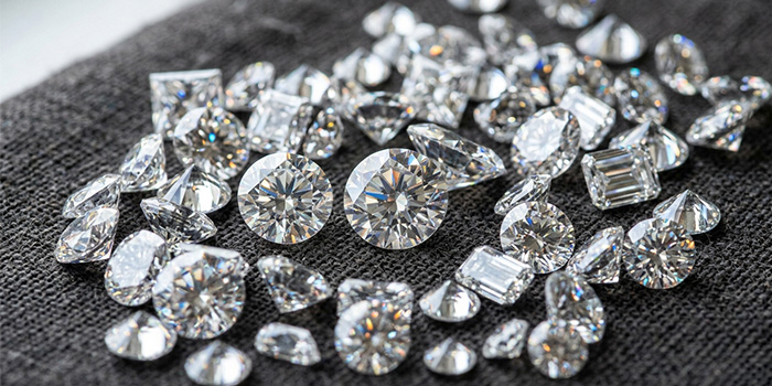 a close-up image of a loose diamonds from various angles