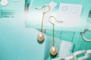 Yellow gold Tiffany & Co. dangle earrings set with pearls.